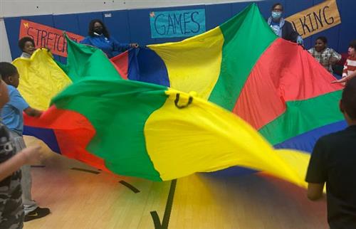  Students and teachers with colorful parachute